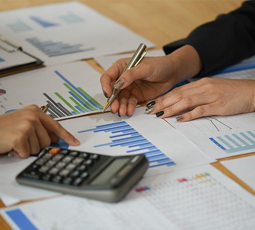 Financial experts analyzing corporate tax data and business charts in Germany